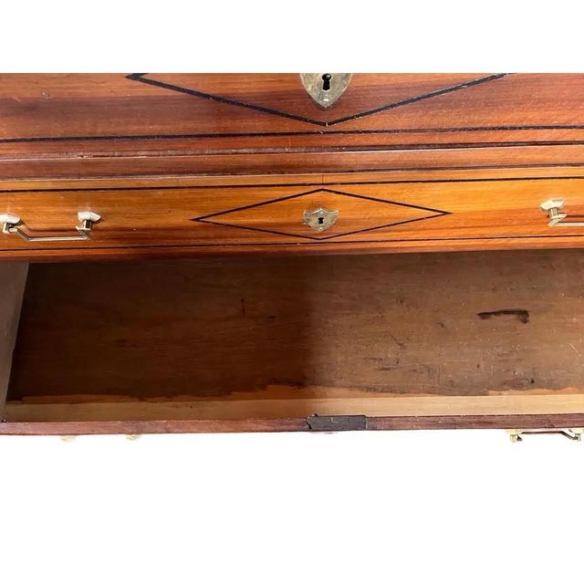 Louis XVI chest of drawers hand-made in France in the late 1700s using walnut and decorated with simple ebonized trim and...