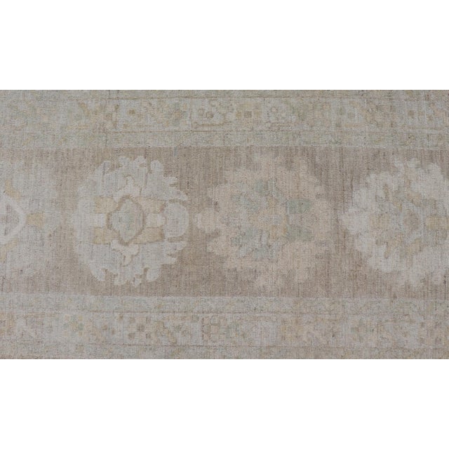 Long Soft Oushak Runner With Sand Field and Pale Green and Blue Accents For Sale - Image 9 of 12