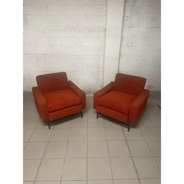Pair of 1960s armchairs with square tubular iron structure and still original fabric upholstery. The padding is healthy,...