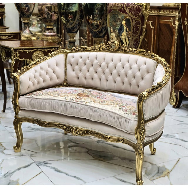 This stunning large beige French-style sofa is a unique piece that combines classic elegance with a touch of luxury....
