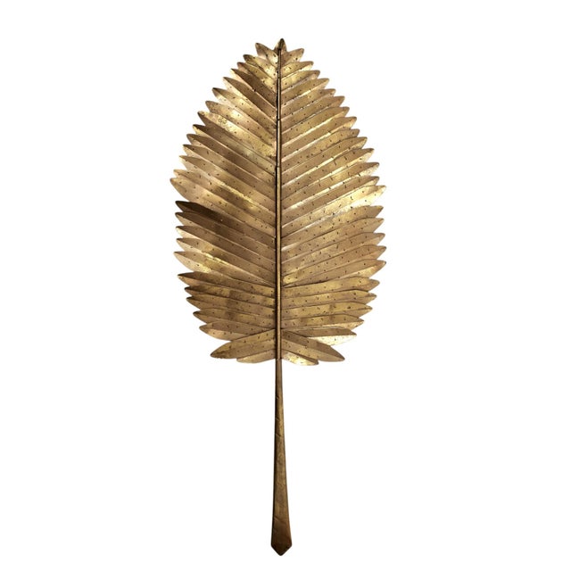 Lofty group of three mid century palm frond sculptures or wall decor handcrafted in perforated metal having a worn gilt...