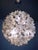Elegant large sputnik chandelier with sixty clear murano glass flowers on a chromed frame. Designed by paolo venini....