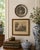 A small but wonderfully detailed mid-20th-century German pewter wall plate by J. Metten, centered by a richly modeled...
