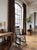 Antique rocking chair dating to the late 19th to early 20th century. Constructed in wood, likely oak, with turned legs and...
