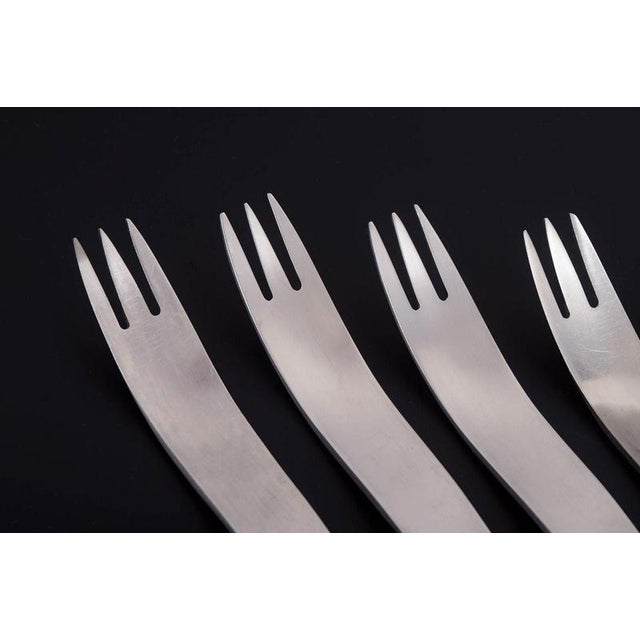 Arne Jacobsen for Anton Michelsen, set of six dinner forks. Set of six stainless steel dinner forks featuring Arne...
