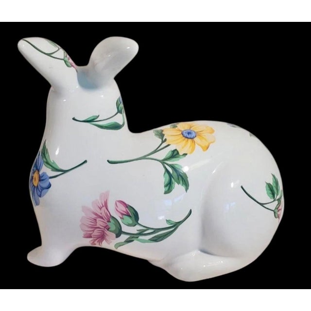 vintage 1996 Tiffany & Co ceramic rabbit figure features hand-painted flowers. Measures at 8 inches length and 6.75 inches...