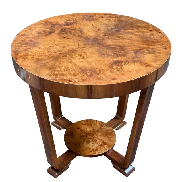 Elegant round Art Deco coffee table dating from the 1920s–1930s. The piece stands out for its clean geometric lines,...