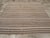 This Mid-20th century Turkish Flatweave Kilim rug, features a classic horizontal striped design, skillfully woven in a...