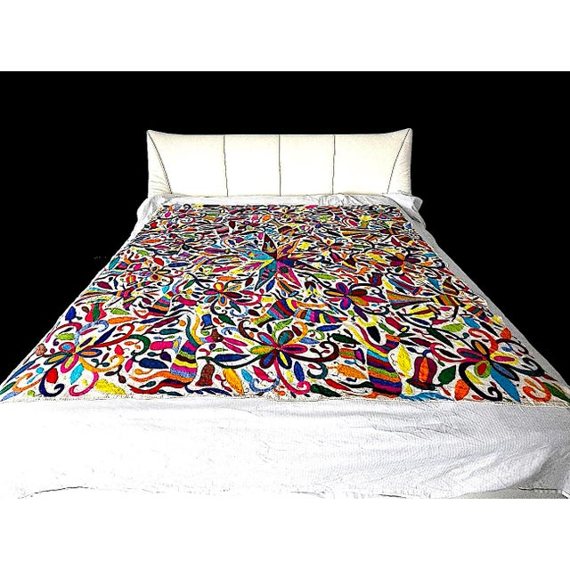 Offered is a hand-embroidered Otomi/Tenango textile from the Hidalgo region of Mexico. The embroidery depicts stylized...