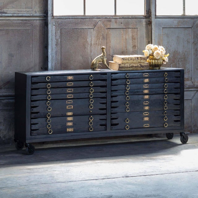Crafted in vintage black mango wood and with brass hardware our Printmakers Console has been reconfigured to accommodate...