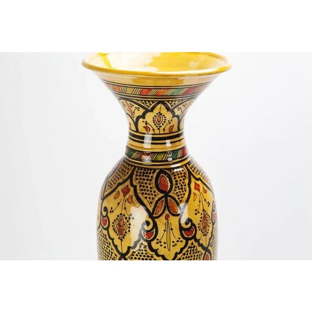 With its intriguing cone-shaped design, absorbing rustic colors of yellow, orange and black, and an elaborately ornate...