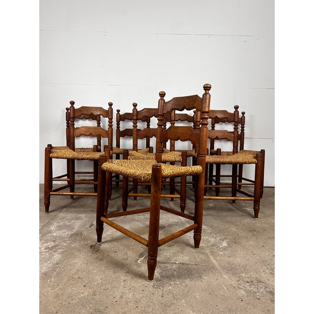 This set of six dining chairs is attributed to Hans Dau and was made in Denmark during the mid-20th century. The chairs...