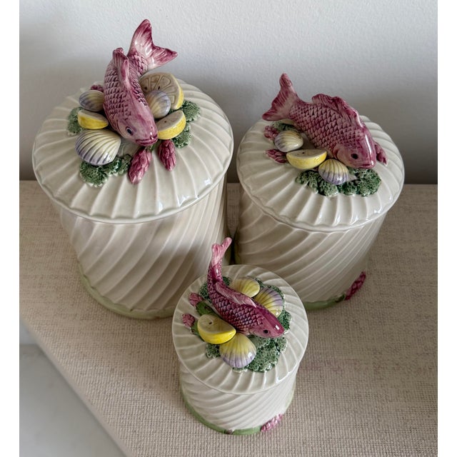 Set of 3 jar canister sets ranging from large to small size by Fitz and Floyd with fish and clams on top. Great for beach...