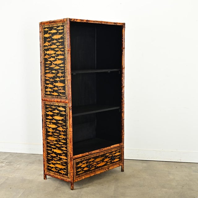 Dimensions: 70” H x 35 ⅝” W x 18 ¾” D This English bamboo bookcase from the Aesthetic Movement of the late 1800s was given...