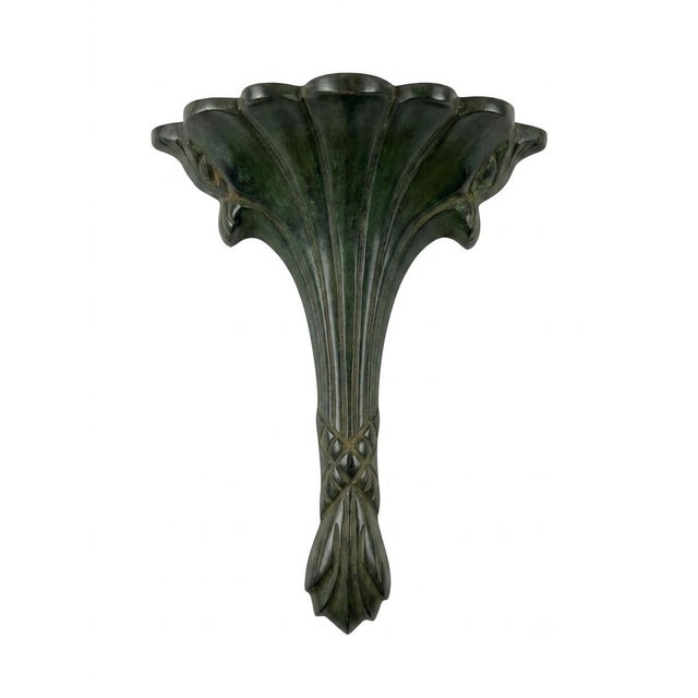 Striking pair of vintage bronze wall sconces. Featuring an elegant Art Deco design and a rich, aged patina, these durable...