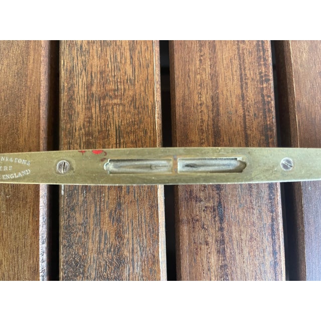 This is a vintage J. Rabone & Sons wood and brass spirit level, often referred to as a "boat level" due to its tapered...
