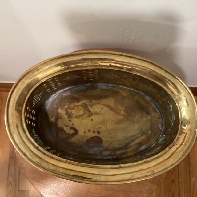 Vintage Brass Planter Flared rim and pierced body resting on scrolled legs with embossed heads Original Patina