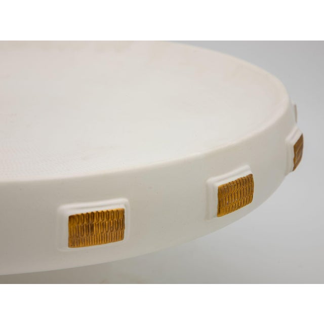 A striking 2016 ceramic pedestal platter by Handley Drive, made in Portugal. The piece features a broad, shallow circular...