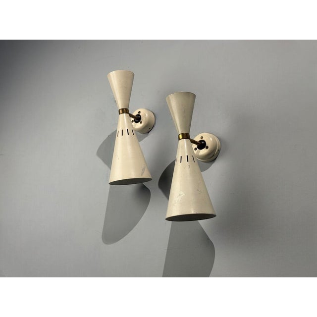 Italian Mid-Century Modern, White Lacquered Metal, Brass, Wall Lights or Sconces, Italy, 1960s Pair of dual light wall...