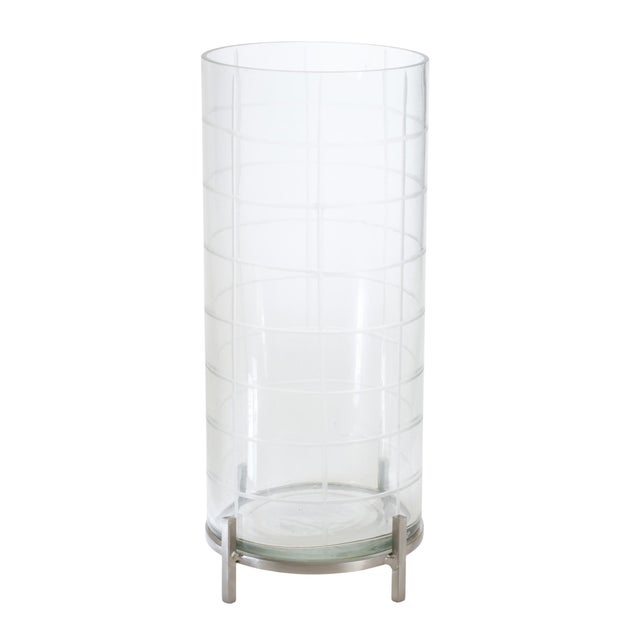 Elevate your home decor with this elegant and versatile Candle Holder, featuring a beautifully etched glass insert paired...