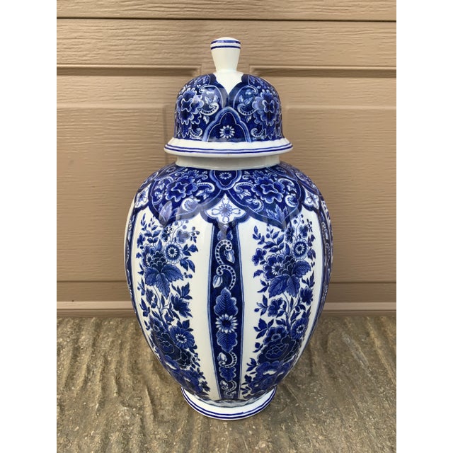 A richly decorated blue and white porcelain ginger jar by Ardalt's Blue Delfia line, crafted in Italy during the mid-20th...