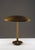 Very rare Swedish Modern table lamp executed in brass and bakelite, model 15339 by Böhlmarks. The design is defined by its...