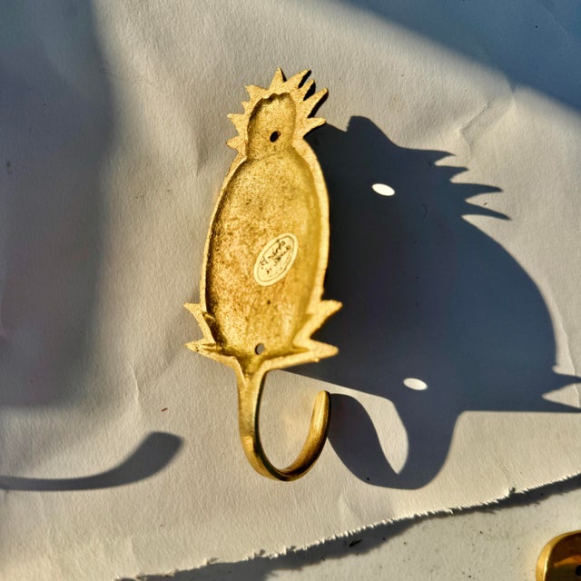 Brass pineapple wall hook. In great shape. Free shipping is offered to help you save on fees!