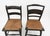A charming set of two vintage hand‑painted folk art rush‑seat chairs, dating to the Mid‑20th Century (1950s–1970s). Each...