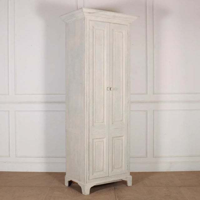 19th C English painted pine two door shelved linen cupboard. 1890. This piece is designed in the style of the selected...
