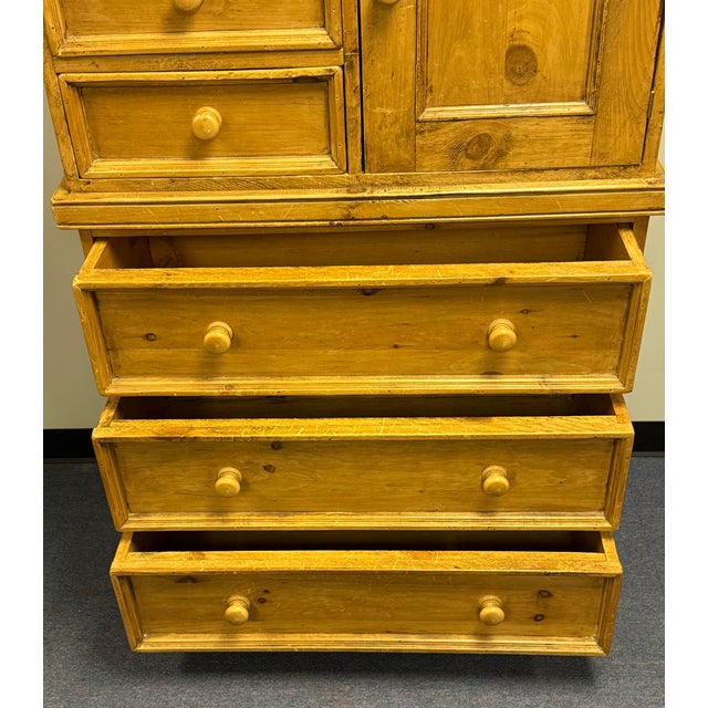 Charming scrubbed pine chest of drawers featuring generously deep 3 large and 3 small drawers and a storage cabinet on a...