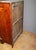 Empire chest of drawers with detached columns in cherry wood, it opens with seven drawers, gray marble top, varnished...