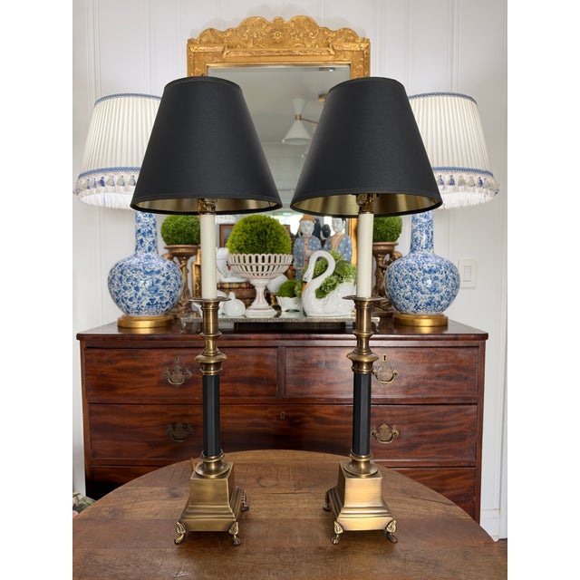 Absolutely perfect pair of tall candlestick lamps in aged brass and classic black. Condition is beautiful and the quality...