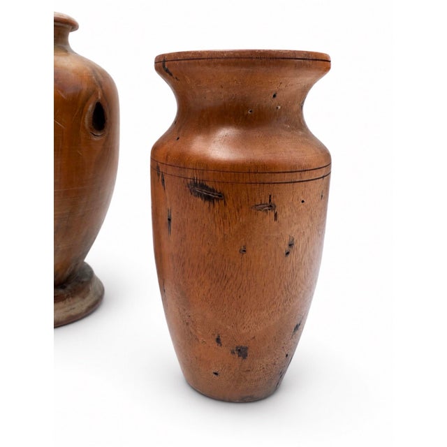 Pair of mid-century hand-turned studio wood vases signed HP on the bases. Each is made from richly figured exotic wood...