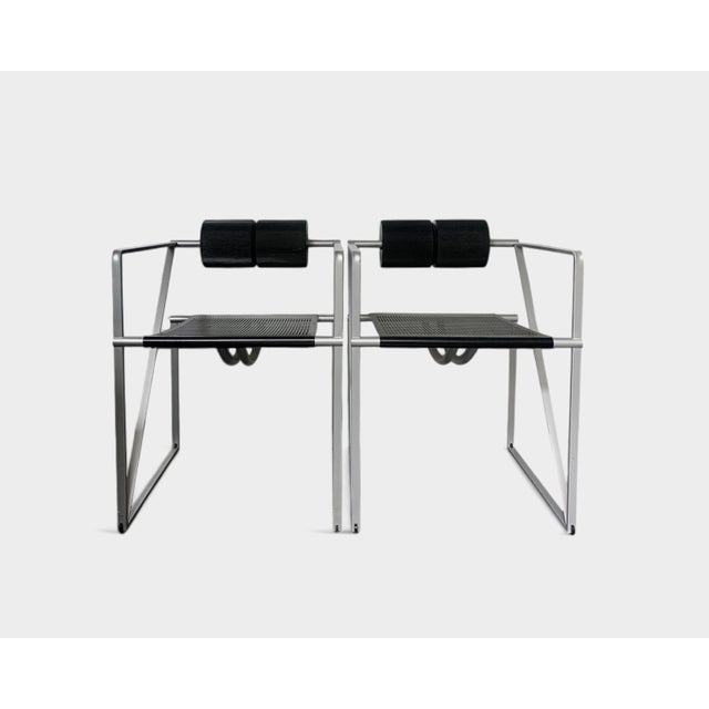 The Seconda Armchair, designed by Swiss architect Mario Botta and crafted by Alias, is a bold icon of postmodern design....