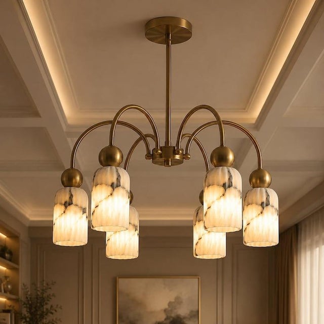 Elevate your interior with this elegant Modern 6 Light Brass Chandelier, designed to bring together sculptural form, warm...