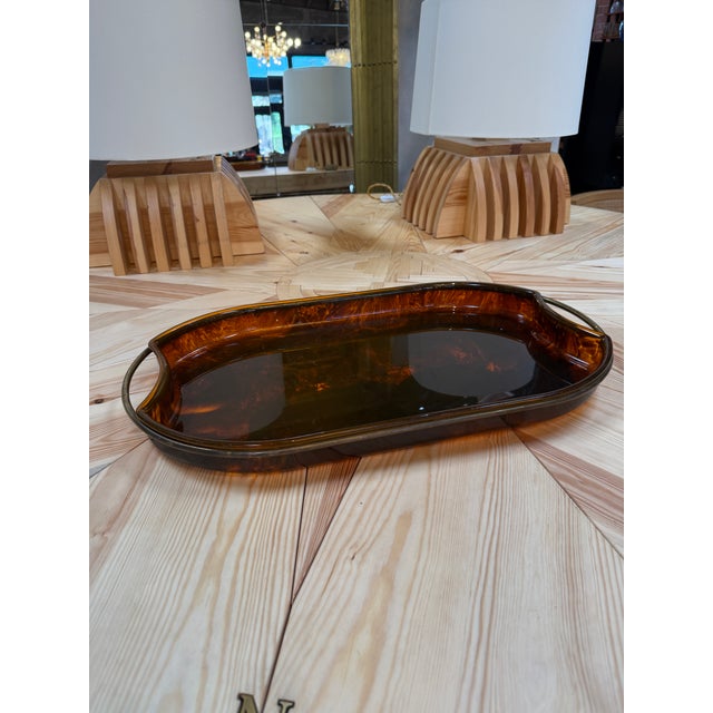 Elegant mid-century Italian serving tray featuring a richly patterned tortoiseshell-effect finish in warm amber and dark...