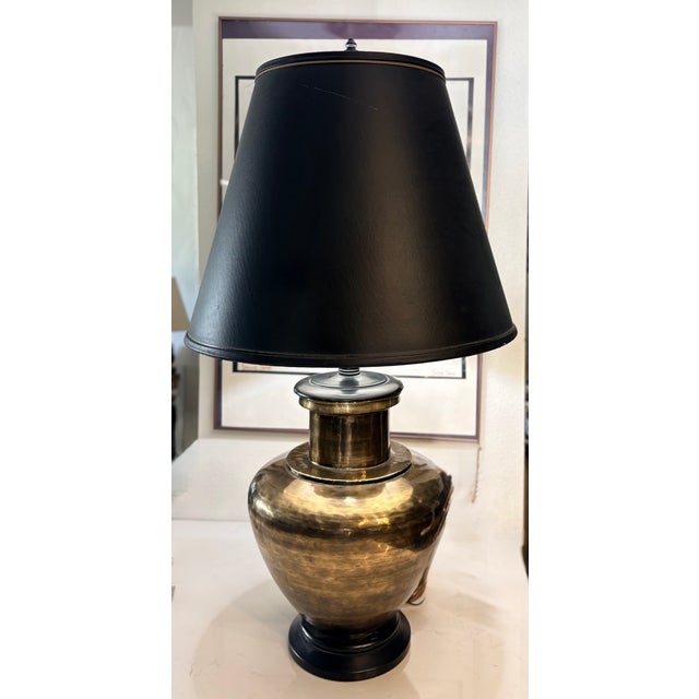 This oversized vintage table lamp is truly a statement piece! A stylized metal ginger jar with a gold brass finish forms...