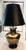 This oversized vintage table lamp is truly a statement piece! A stylized metal ginger jar with a gold brass finish forms...