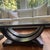 Pair of black finished Art Deco Style coffee tables. Have two protective glass tops.