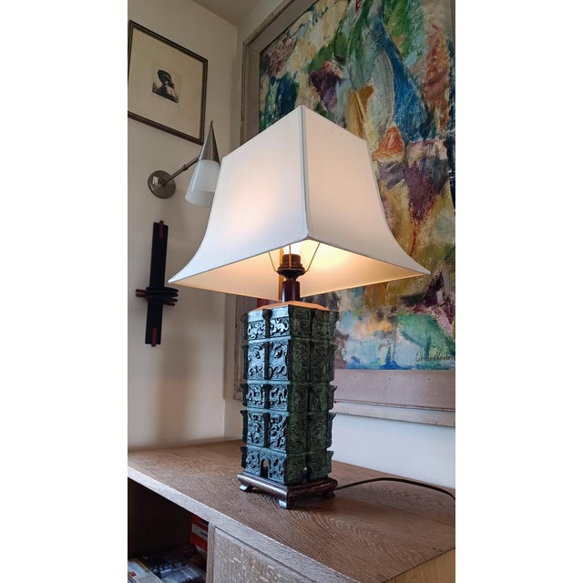 A fabulous chinese taotie* bronze urn table lamp. Also known as pagoda (which it is not). the lampshade depicts the roof...