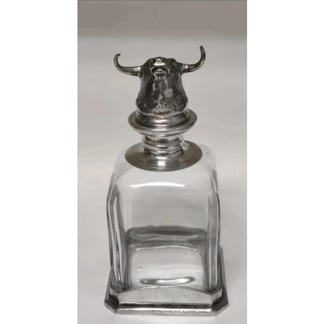 For your consideration. . . PACIFIC LIFE Pewter and Crystal Decanter designed with a figural Longhorn / Bull head stopper....