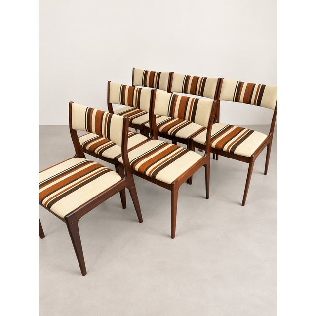 A beautiful set of six Danish dining chairs designed by Johannes Andersen, dating from the 1960s. Crafted from rosewood,...
