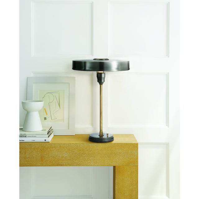 Carlo Table Lamp in Bronze and Hand-Rubbed Antique Brass Designer: Thomas O'Brien Height: 21" Shade Detail: 3" x 15.5"...