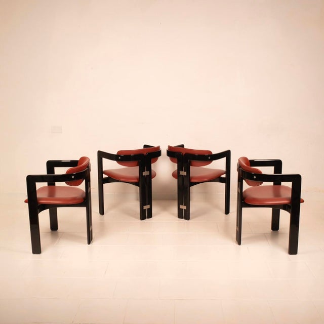 Extraordinary and iconic set of four "Pamplona" chairs designed by Augusto Savini for Pozzi in the late 1960s. The...