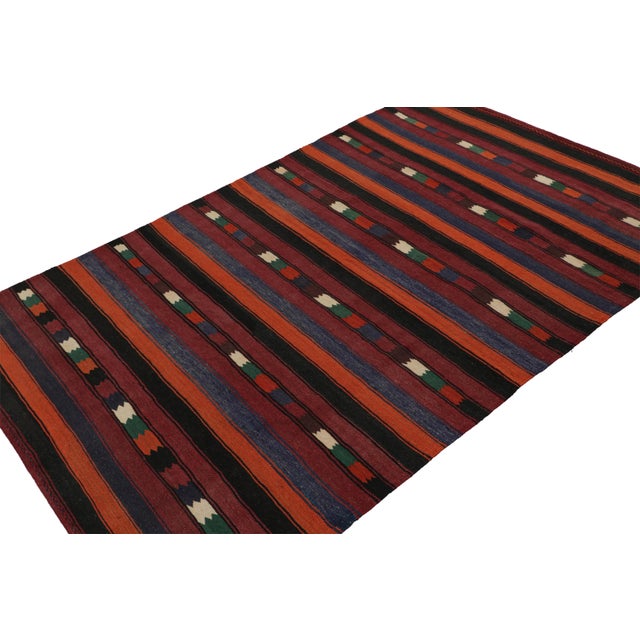 Handwoven in wool, circa 1950-1960, this 5x7 vintage Afghan tribal kilim rug seems to draw on Karabagh Kilims and similar...