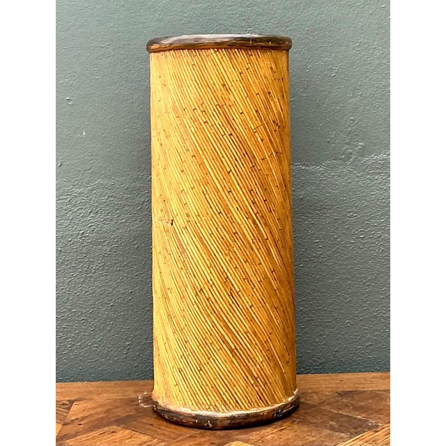 This vintage cylinder pedestal showcases the timeless appeal of natural materials and refined mid-century craftsmanship....