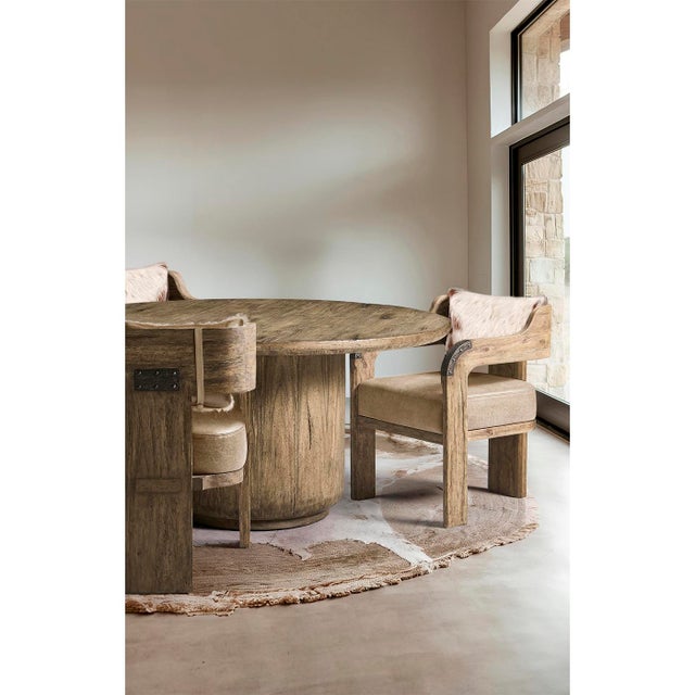 The armchair combines modern design with classic ranch-inspired materials. Its solid wood frame, finished in warm Tully...