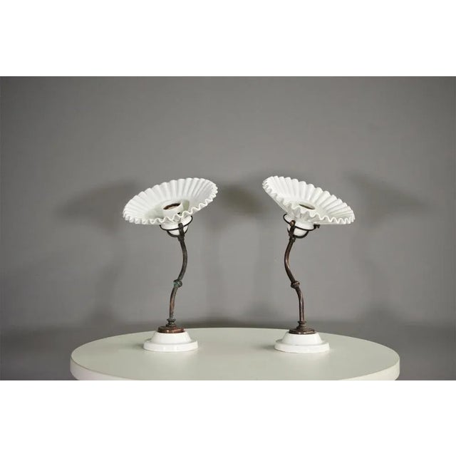 Wall lamps Aldibernardi in brass and ceramic from the 1970s. European Plug (up to 250V).The wiring of this item may be...