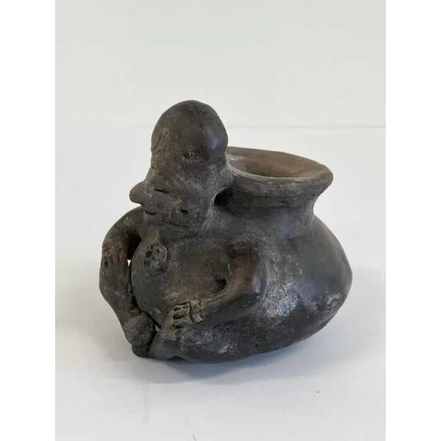 This antique small figurative pot, crafted in the style of Pre-Columbian pottery (likely Central or South American...