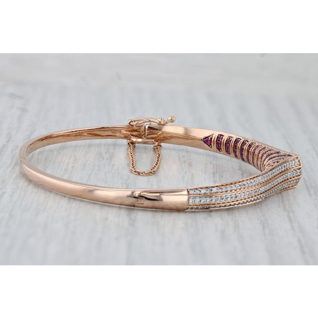 Gemstone Information: - Natural Rubies - Total Carats - 0.88ctw Cut - Round Brilliant Color - Red Treatment - Routinely...